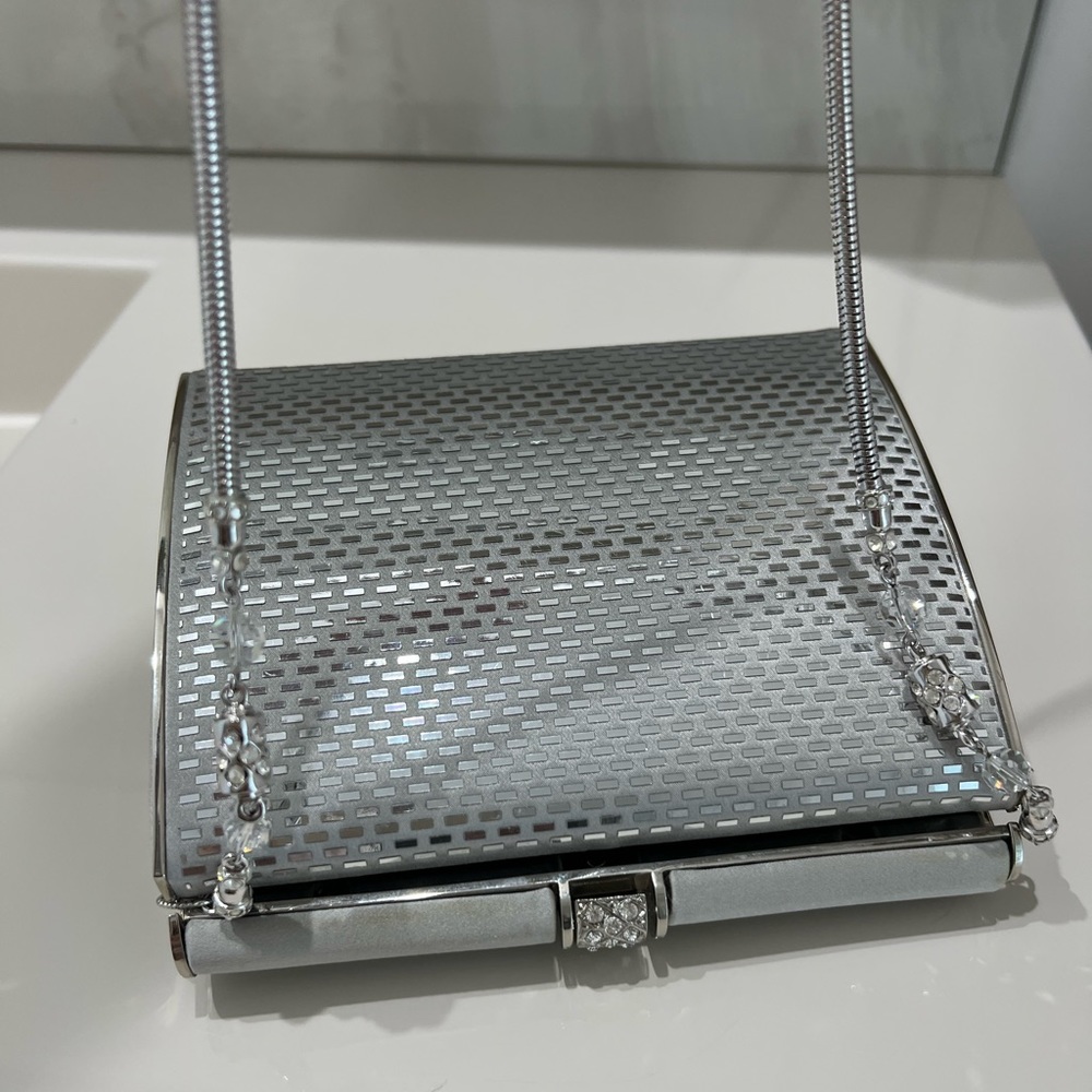 St. John, stunning , silver & embellished clutch with chain. Like new.